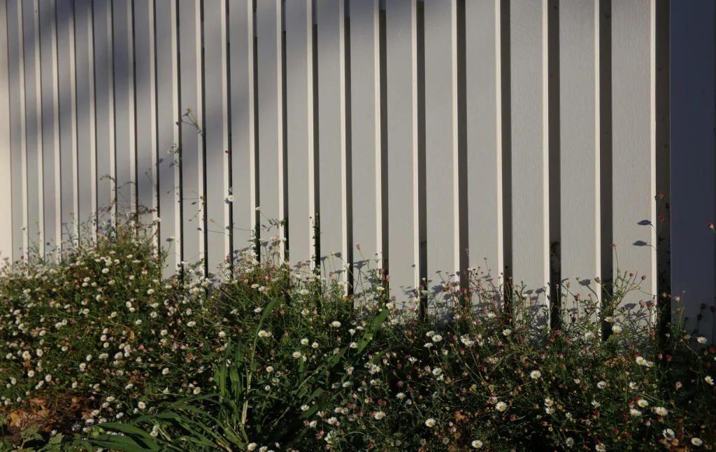 Lightly painted board fence
